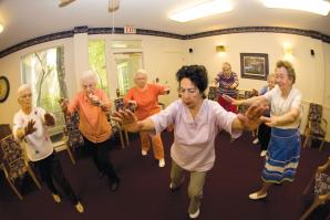 Residents of the Chateau at River's Edge participate in a Tai Chi class. 