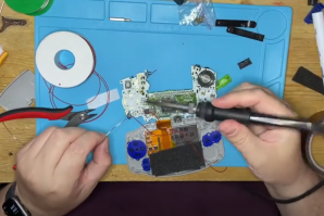A moder restores a Game Boy Advance SP with new plastic case and rechargeable battery. (Screenshot provided by Darkone Customs)