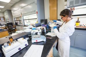 Criminalist Caitlin Little pours nearly 450 grams (about one pound) of methamphetamine into an evidence bag at the Sacramento County District Attorney’s Crime Lab. This is considered a large methamphetamine case compared to the average case of .20 to .25 grams, according to Jill Ibarreta, the supervising criminalist of the lab’s chemistry section.